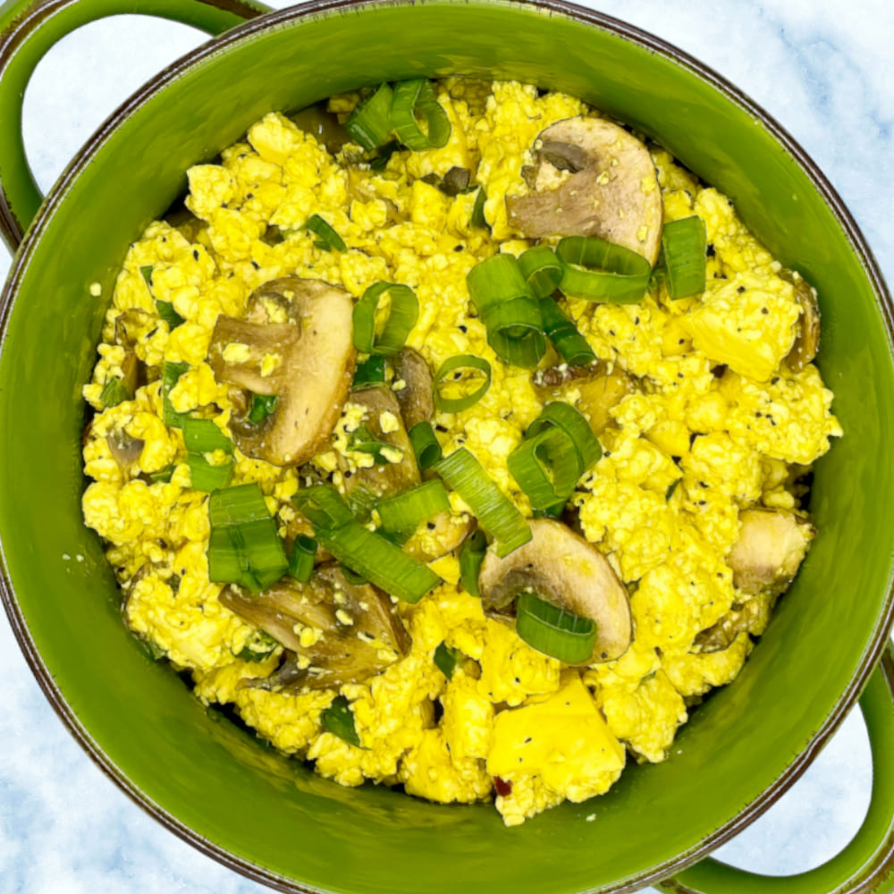 Organic tofu scramble with mushrooms and green onion, vegan.