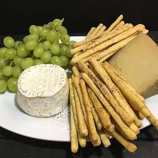 Jennifers-homemade-rsalt-and-pepper-breadsticks-plate-nourish-organic-vegan-food-houston-cg